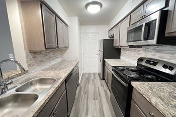 our apartments have a modern kitchen with stainless steel appliances at Deercross Apartments, Cincinnati, OH 45236